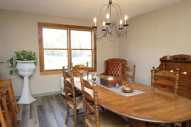 dining room featuring a notable chandelier and dark hardwood / wood-style floors