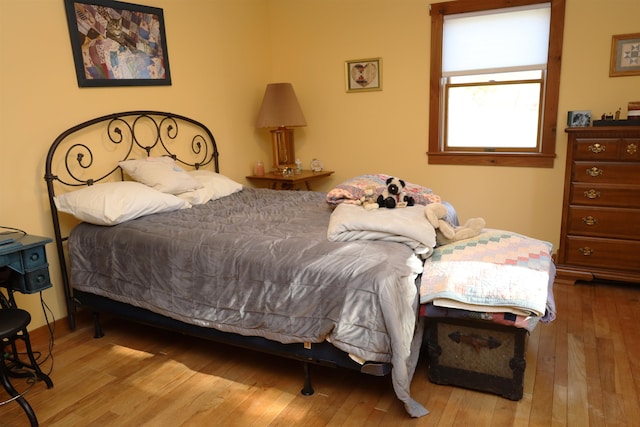 bedroom with light wood-type flooring