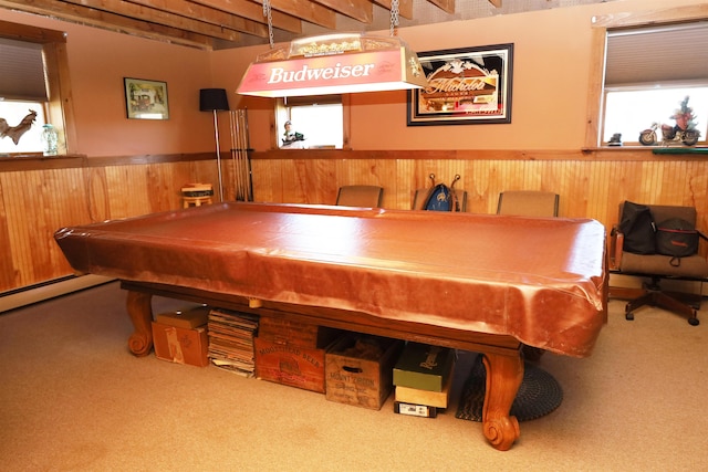 game room featuring carpet flooring, beamed ceiling, and wooden walls