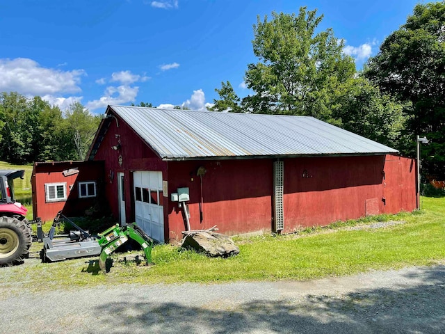 view of outdoor structure with a lawn