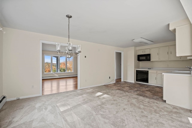 kitchen with baseboard heating, black appliances, decorative light fixtures, white cabinets, and carpet flooring