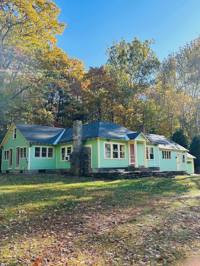 ranch-style house with a front lawn