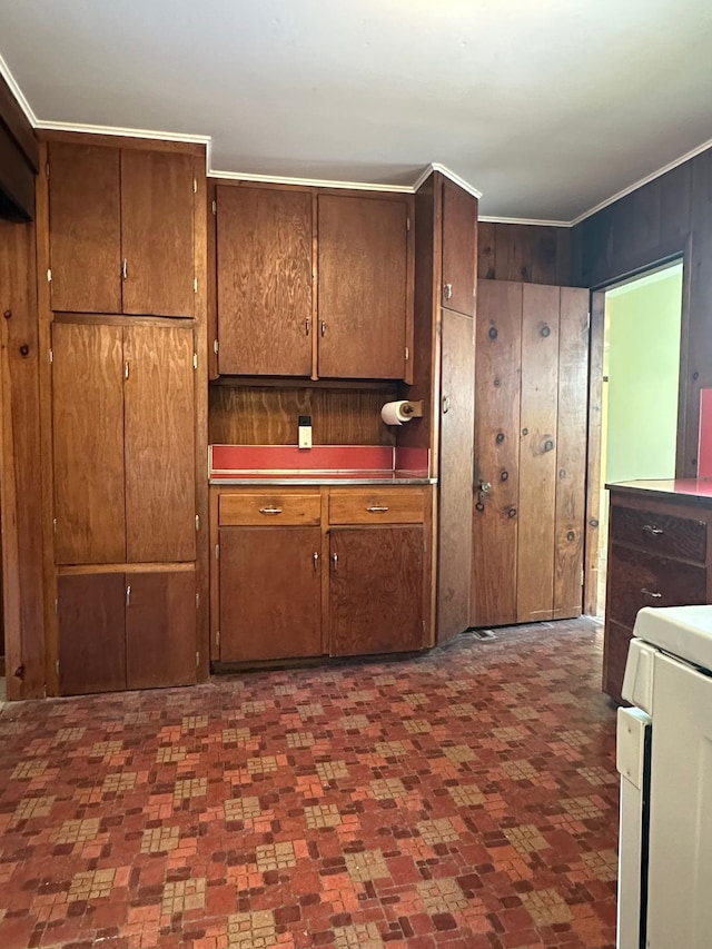 kitchen featuring wooden walls