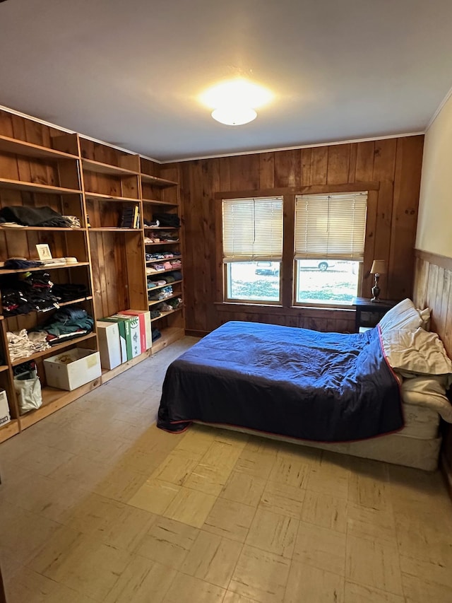 bedroom featuring wooden walls