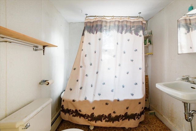 bathroom featuring toilet and a wealth of natural light