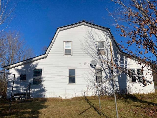 view of home's exterior featuring a lawn