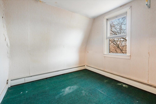 carpeted spare room with lofted ceiling and a baseboard radiator