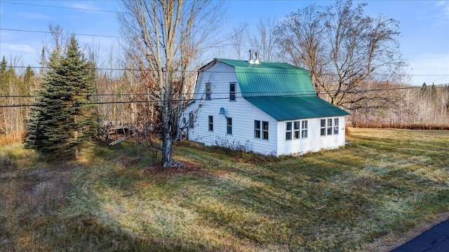 view of property exterior with a yard