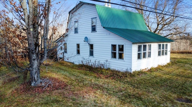 view of property exterior featuring a yard