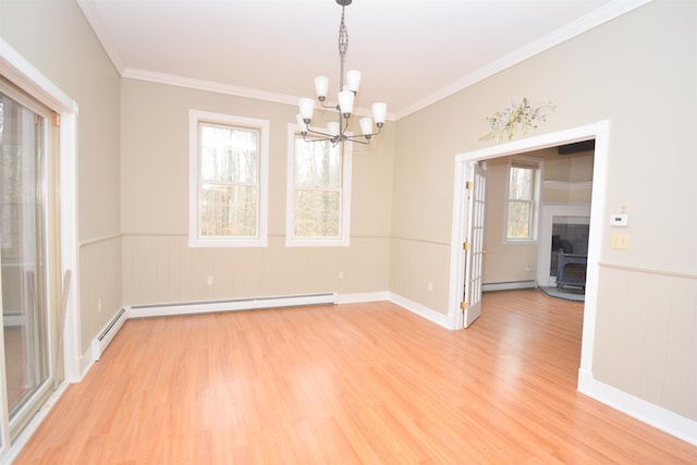 unfurnished room featuring ornamental molding, baseboard heating, a chandelier, and light wood-type flooring