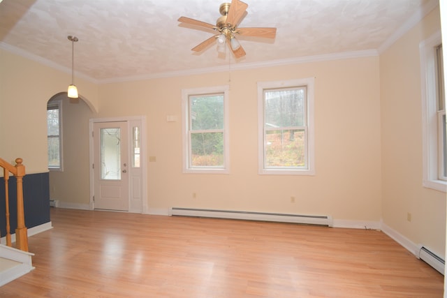 foyer entrance featuring a baseboard radiator, ornamental molding, light hardwood / wood-style floors, and ceiling fan