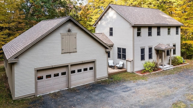 view of property exterior featuring a garage