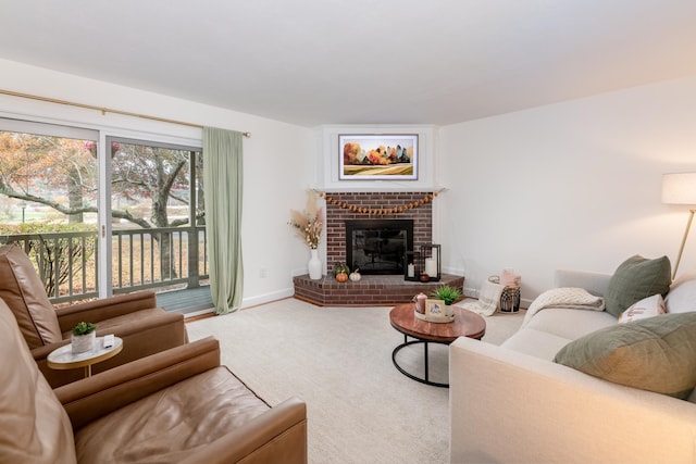 living room featuring carpet flooring and a brick fireplace