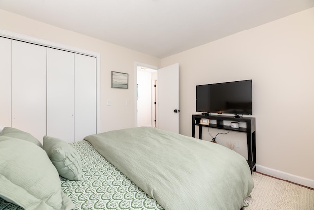 carpeted bedroom featuring a closet