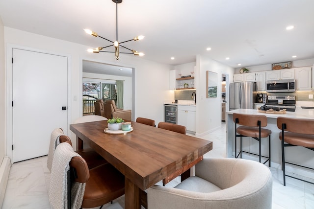 dining space with a notable chandelier and beverage cooler