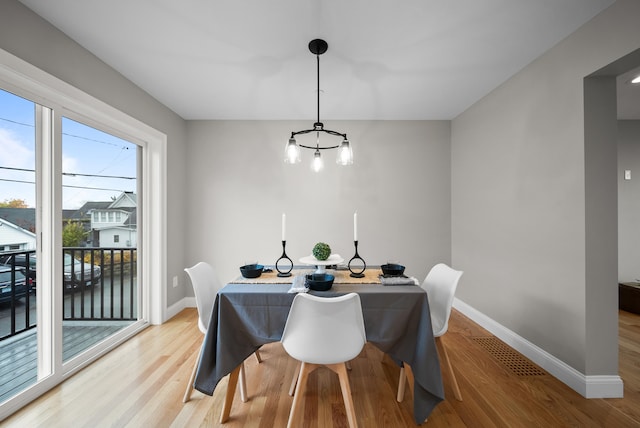 dining area with light hardwood / wood-style flooring