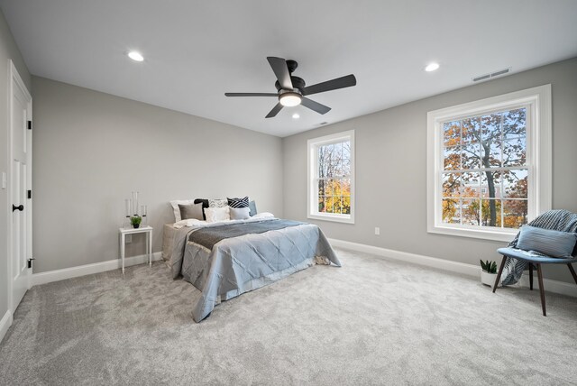 carpeted bedroom with ceiling fan