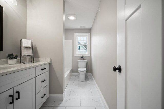 bathroom with toilet, a bathing tub, and vanity