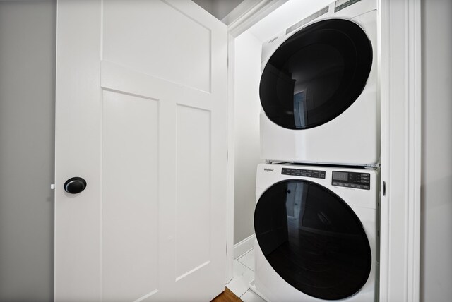 laundry room with stacked washer and clothes dryer