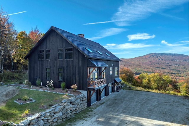 view of home's exterior featuring a mountain view