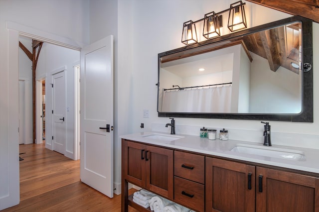 bathroom featuring vanity, a shower with shower curtain, and hardwood / wood-style flooring