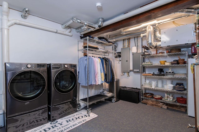 clothes washing area featuring washer and dryer, electric panel, and carpet flooring