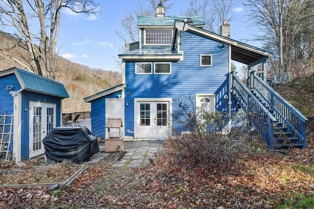 back of house featuring french doors