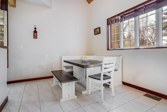 dining area featuring light tile patterned floors