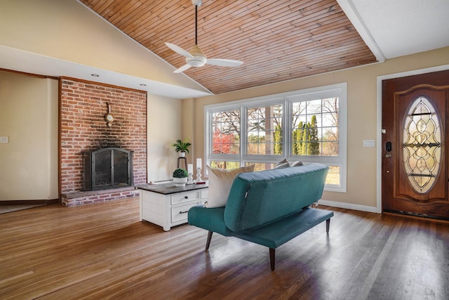 interior space featuring hardwood / wood-style floors, vaulted ceiling, wood ceiling, and ceiling fan