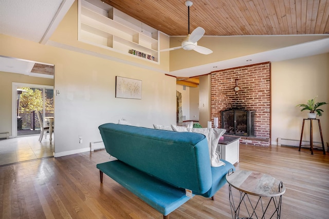 living room featuring wooden ceiling, wood-type flooring, a baseboard radiator, and a brick fireplace