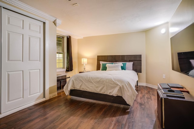 bedroom featuring dark hardwood / wood-style floors