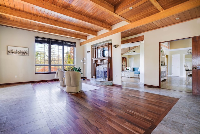 interior space with wood ceiling, hardwood / wood-style floors, and beamed ceiling