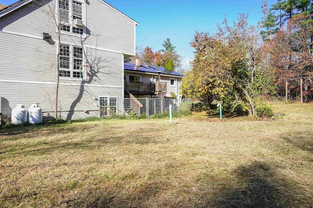 rear view of house featuring a yard