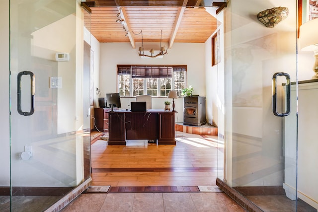 office space with wood ceiling, beam ceiling, an inviting chandelier, and hardwood / wood-style floors