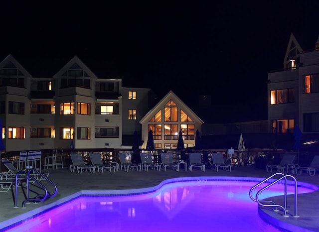 view of pool at night