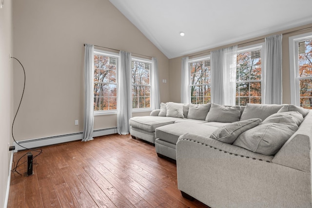 155 E Shore Dr, Weare, NH 03281 - living room with lofted ceiling, healthy amount of natural light, hardwood / wood-style flooring, a baseboard radiator, and recessed lighting