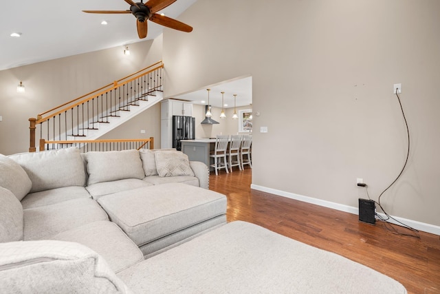155 E Shore Dr, Weare, NH 03281 - living area featuring ceiling fan, baseboards, wood finished floors, stairway, and recessed lighting