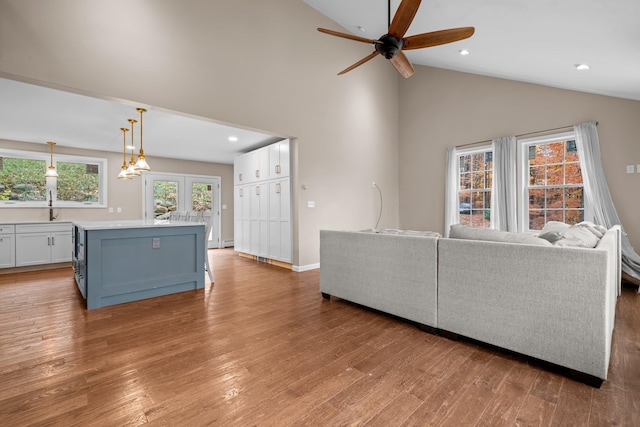 155 E Shore Dr, Weare, NH 03281 - living area with a ceiling fan, light wood-style flooring, high vaulted ceiling, recessed lighting, and baseboards
