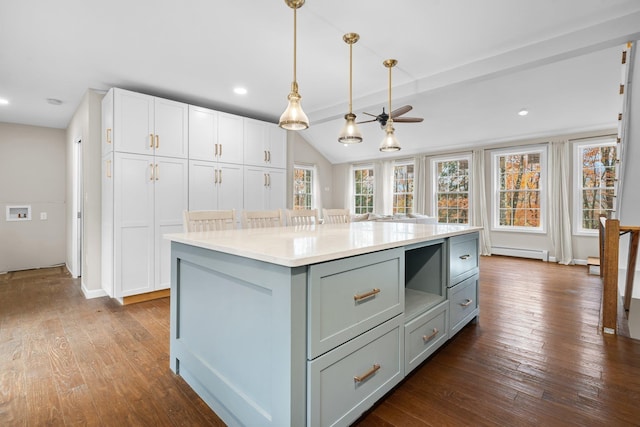 155 E Shore Dr, Weare, NH 03281 - kitchen featuring a baseboard heating unit, gray cabinetry, white cabinets, decorative light fixtures, and light countertops