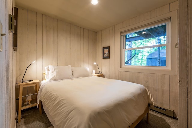 11 Founders Hill Rd, Winhall, VT 05340 - carpeted bedroom with wood walls and baseboard heating