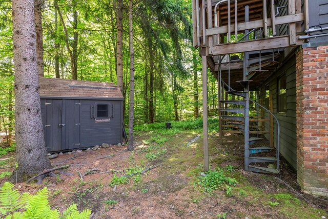 11 Founders Hill Rd, Winhall, VT 05340 - view of yard featuring stairs, an outbuilding, and a storage unit