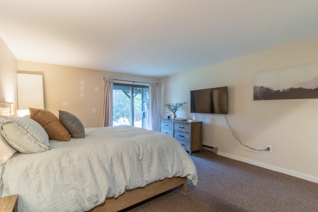 carpeted bedroom featuring a baseboard heating unit