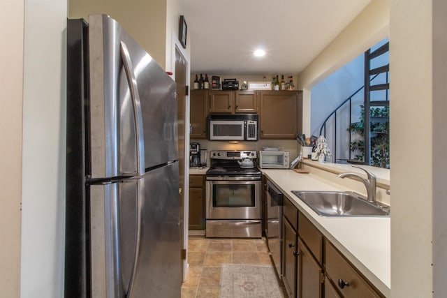 kitchen with appliances with stainless steel finishes and sink