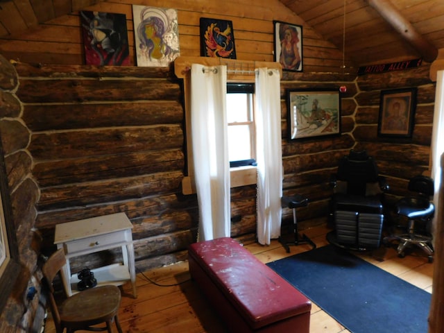 living room featuring lofted ceiling, hardwood / wood-style floors, and wood ceiling