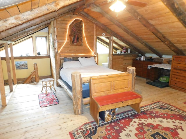 bedroom with light wood-type flooring, wood ceiling, ceiling fan, and vaulted ceiling with beams