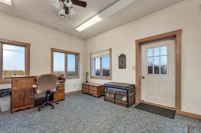 carpeted office featuring a wealth of natural light and ceiling fan