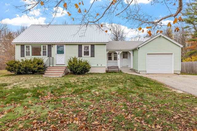 single story home with a garage and a front yard