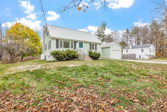 view of front of house featuring a garage and a front lawn