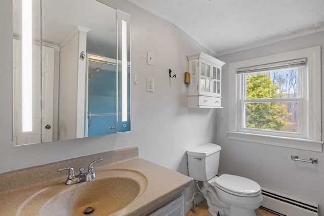 bathroom featuring a baseboard heating unit, toilet, a shower with door, vanity, and crown molding