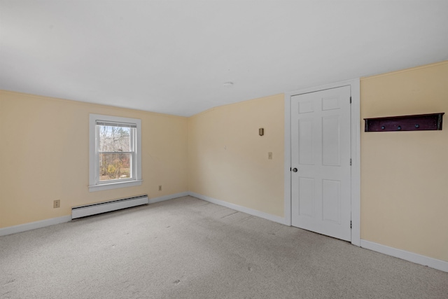 carpeted empty room with a baseboard radiator